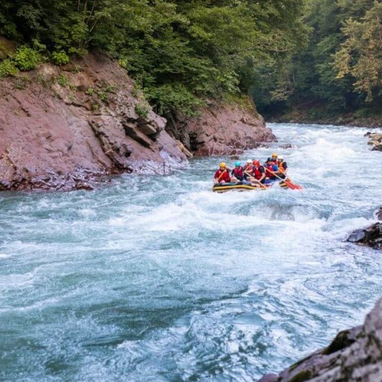 Group of turists rafting on the river, extreme and fun sport at tourist attraction natural park Campania