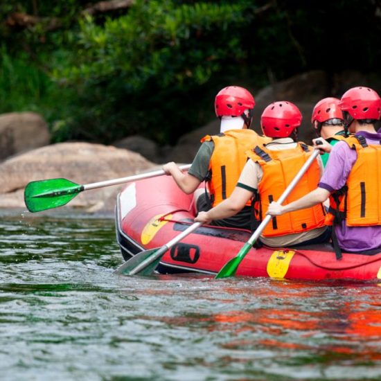 Young person rafting on the river, extreme and fun sport at tourist attraction natural park Campania